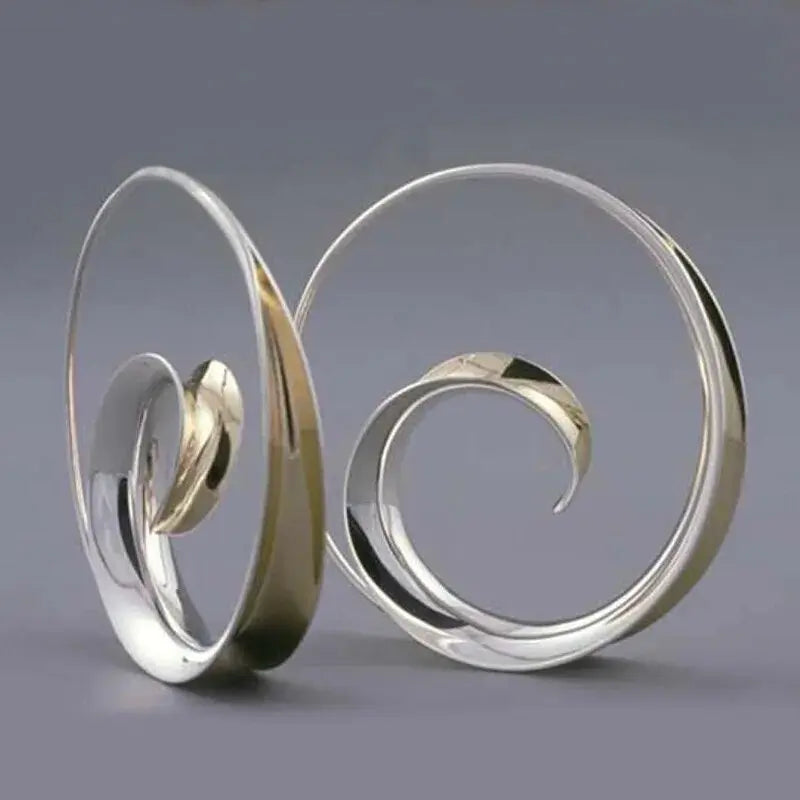 Vintage earrings with spiral waves